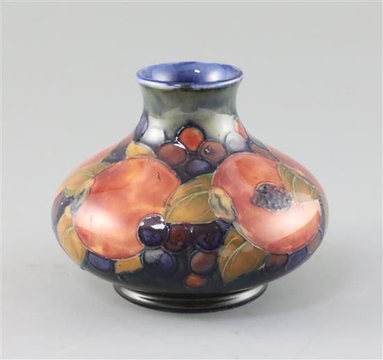 A Moorcroft pomegranate squat baluster vase, c.1918-26, H.10.3cm